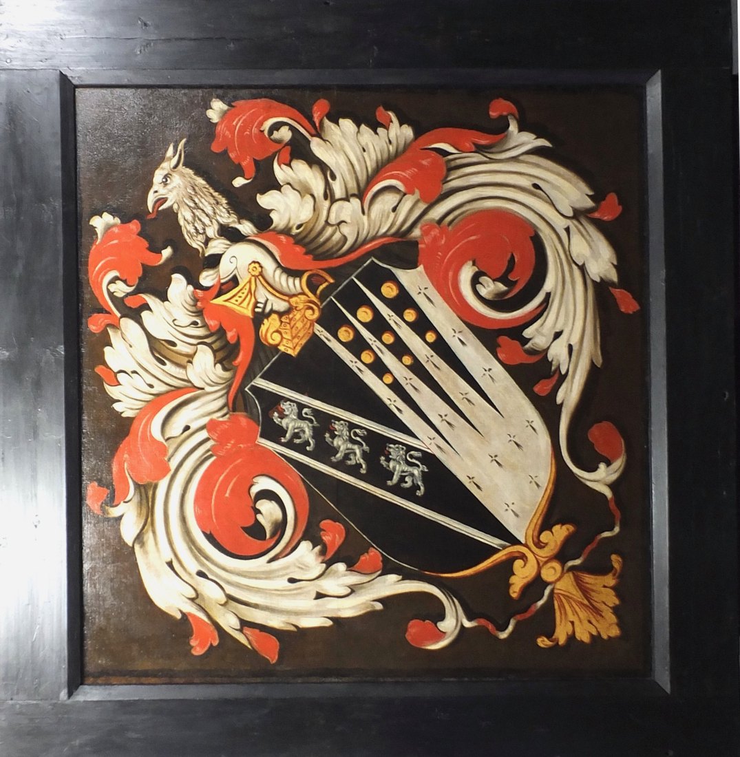 Conserved hatchment from Powerstock Church, Dorset: a square framed heraldic panel with a griffin crest, scarlet and cream scrolling mantling, and a black shield bearing silver lions and gold roundels